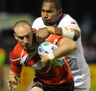 Japan fullback Shaun Webb is tackled from behind, Tonga v Japan, Rugby World Cup, Northland Events stadium, Whangerei, New Zealand, September 21, 2011