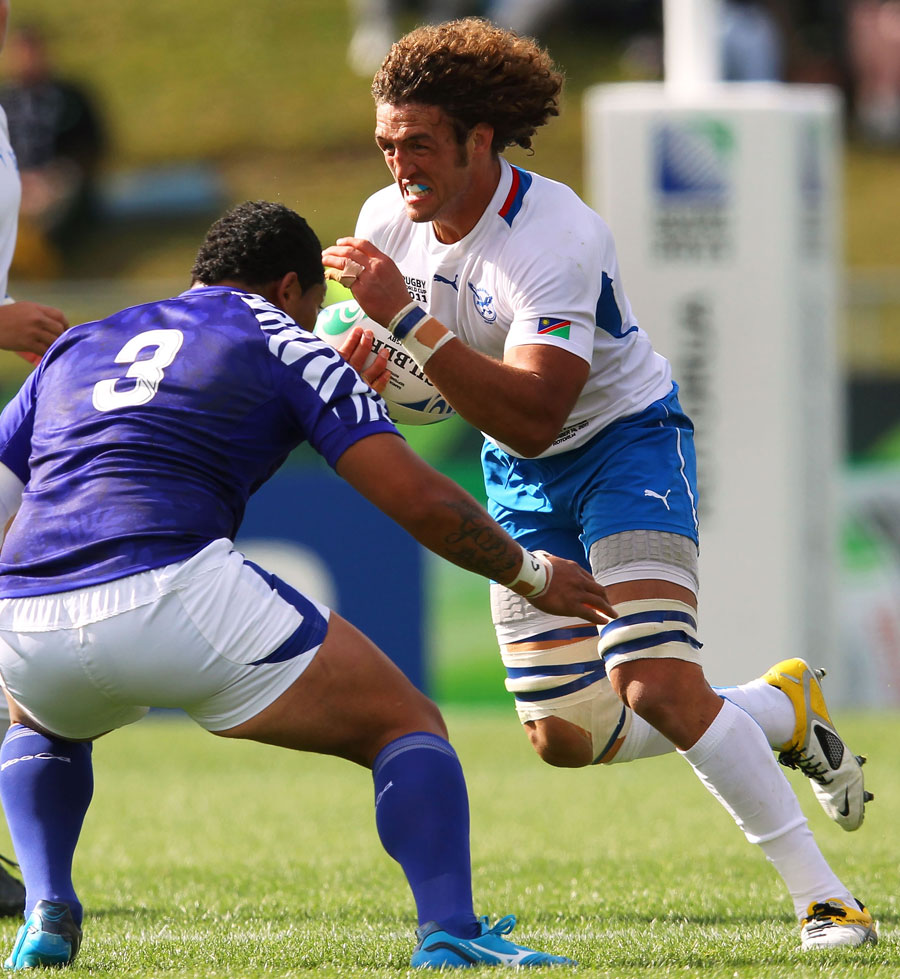 Namibia flanker Jacques Burger of Namibia charges forward