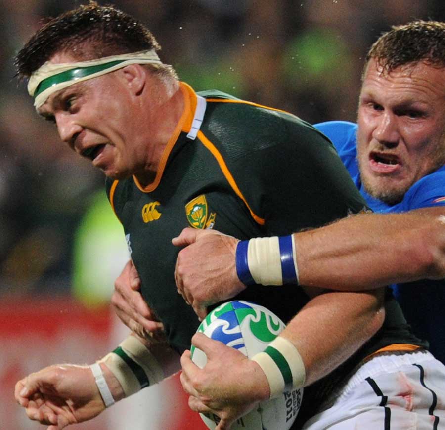 South Africa's John Smit attempts to force his way through the Namibian defence