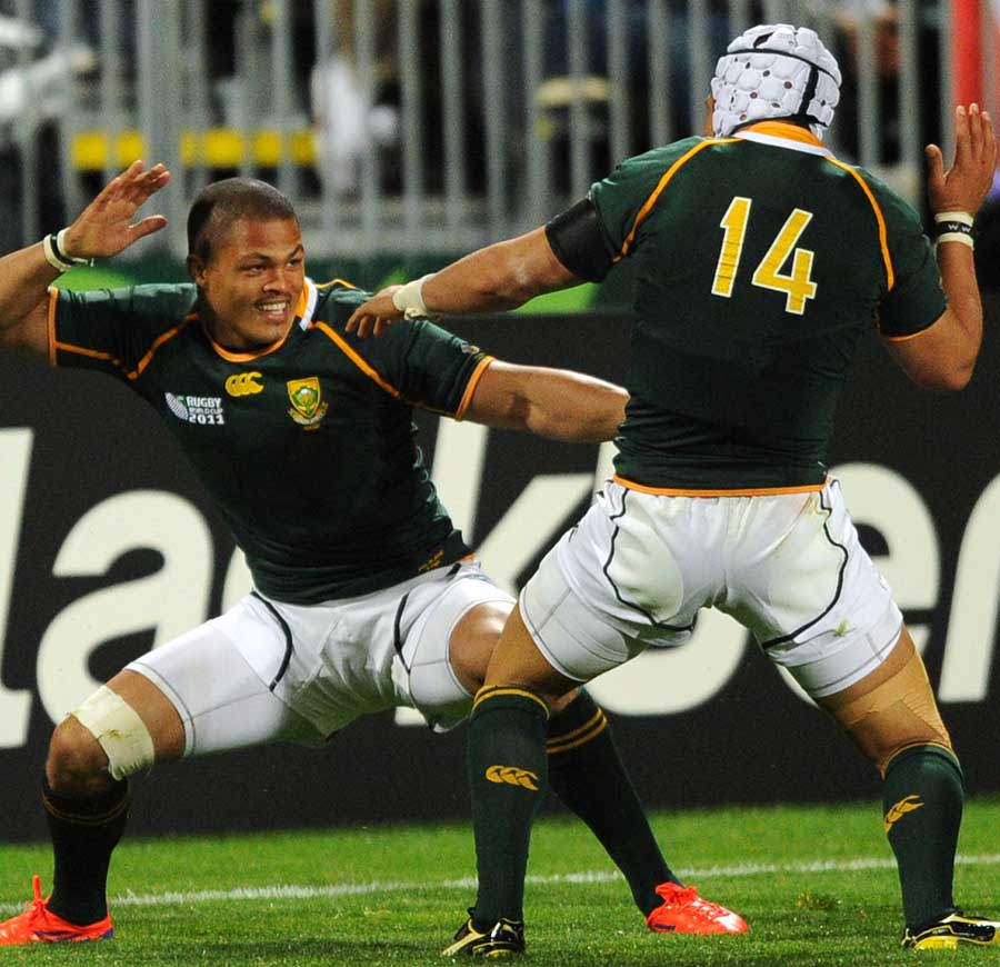 Juan de Jongh celebrates with Gio Aplon after running in his second try in South Africa's rout of Namibia