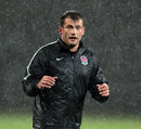 England wing Mark Cueto braves the downpour in training