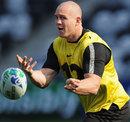 Mike Tindall passes the ball during training