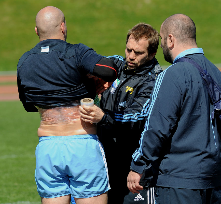 Recent rib injury victim Felipe Contepomi is wrapped up at the end of a training session
