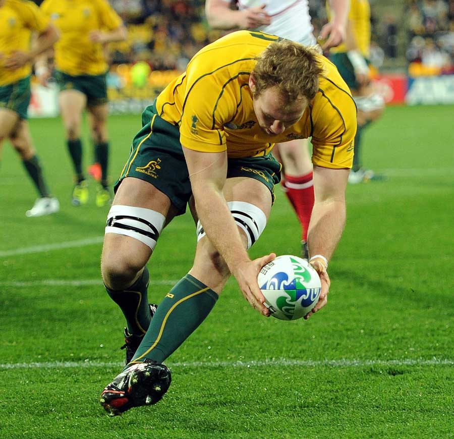 Australia's Rocky Elsom crosses for their second try of the game against the USA