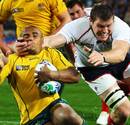 Australia's Will Genia finds his way blocked by Hayden Smith