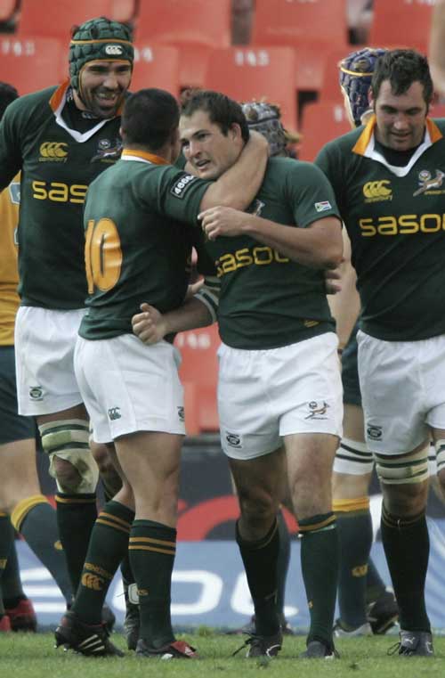 Fourie Du Preez is congratulated after scoring