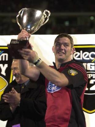 Reuben Thorne lifts the 2002 Super 12 trophy following the Crusaders' victory over the Brumbies at Lancaster Park, 25 May 2002