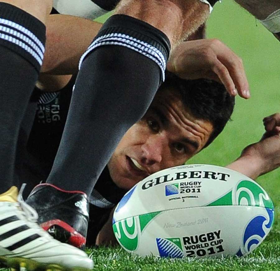 New Zealand's Dan Carter finds himself at the bottom of a ruck