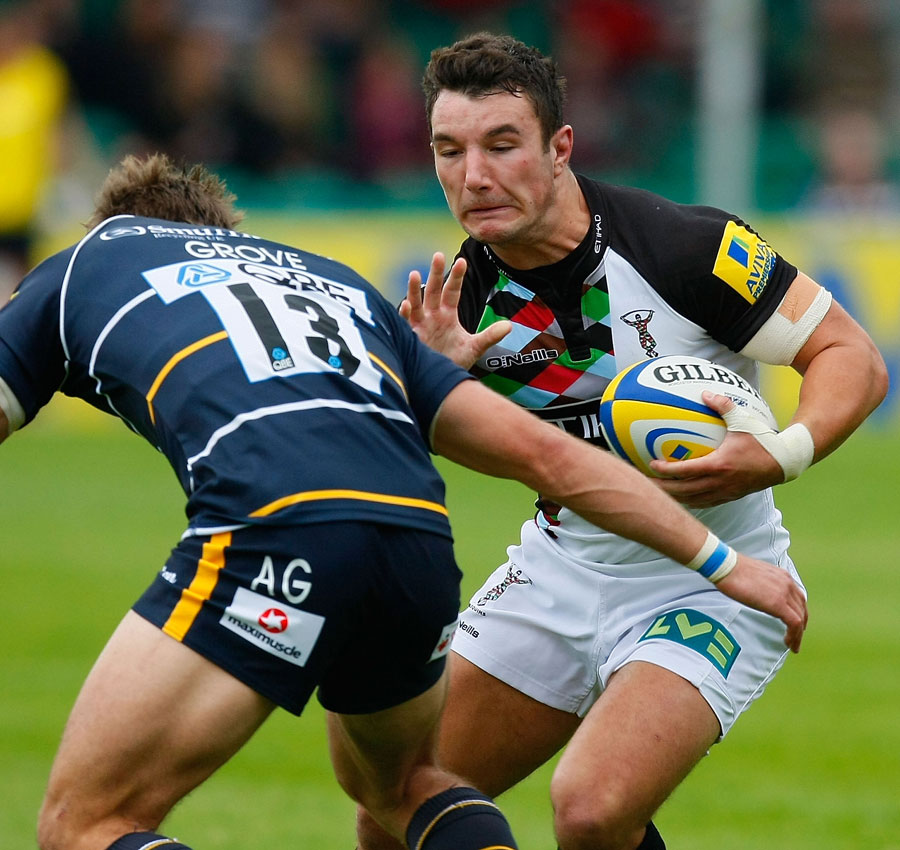Harlequins centre George Lowe tries to jink past Worcester's Alex Grove