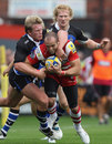 Gloucester winger Charlie Sharples is set upon by Bath's Michael Claassens
