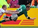Ireland's Keith Earls dives in for their bonus-point try