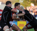 Japan fly-half James Arlidge is swallowed up by the Canada defence