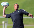 England's Courtney Lawes limbers up in training
