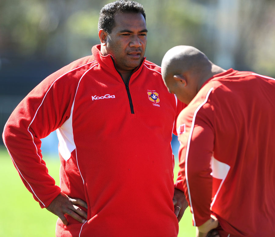 Tonga's coach Isitolo Maka talks to one of his players during a training session