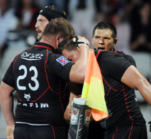 Lyon lock Coenie Basson is congratulated after his try