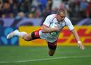 Russia's Denis Simplikevich dives across for his try