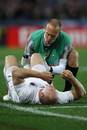 England's Mike Tindall receives attention on the side of the pitch