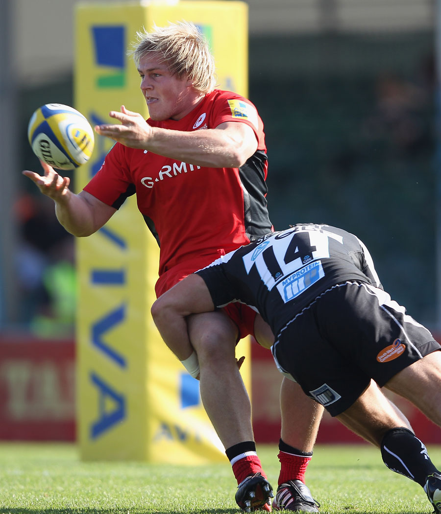 Saracens prop Rhys Gill offloads in the tackle