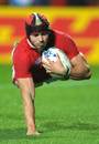 Wales' Leigh Halfpenny crosses the try-line