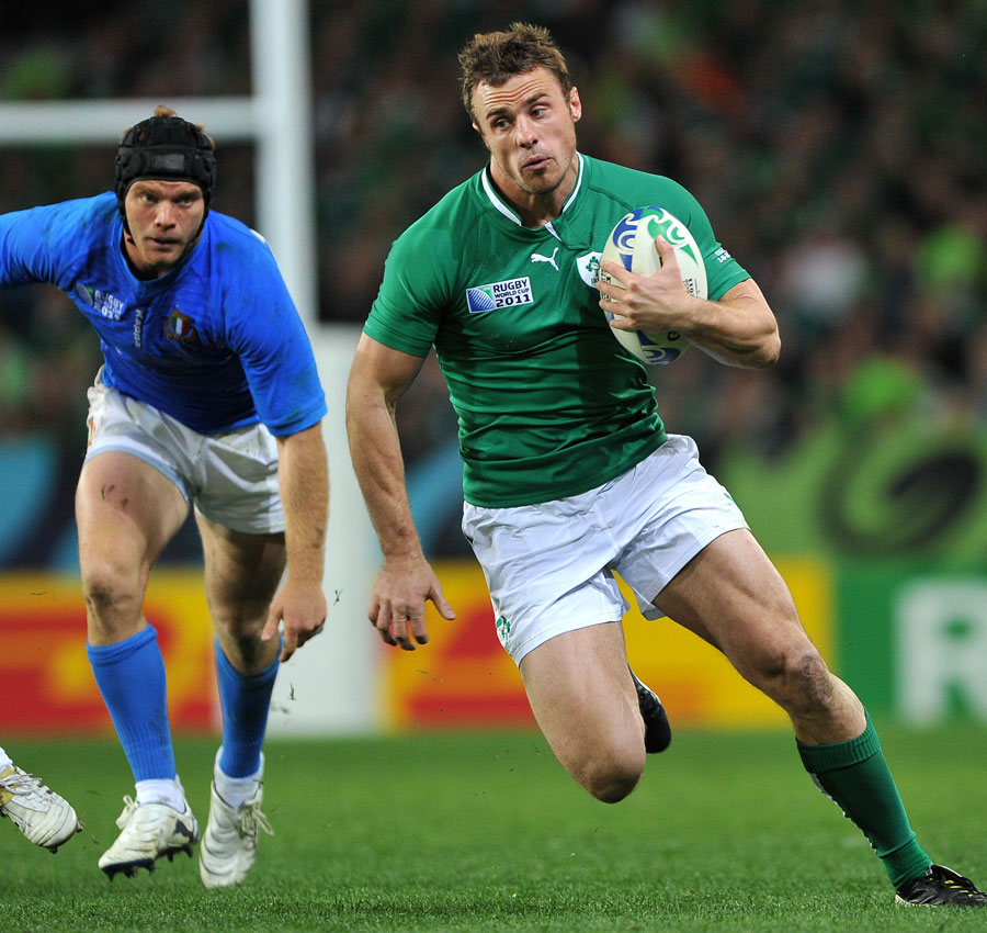 Ireland's Tommy Bowe bursts through Italy's defence