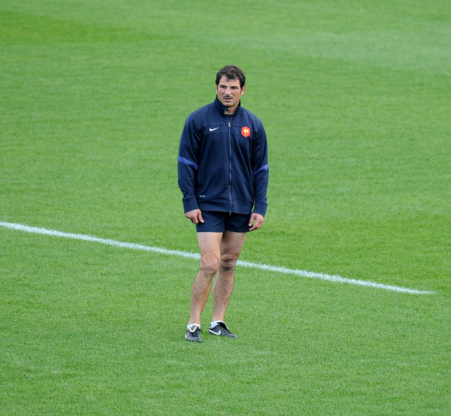 France's head coach Marc Lievremont stands in isolation during training
