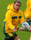 Australian wing Digby Ioane throws out a pass at the captain's run