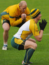 Australia's Berrick Barnes and Stephen Moore do some stretching