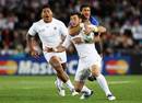 England fullback Ben Foden is caught by Maxime Mermoz