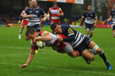 Gloucester's Henry Trinder stretches to score a try