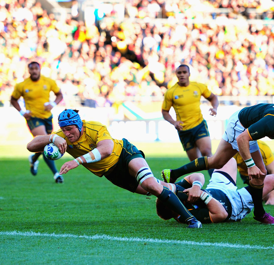 Australia's James Horwill stretches for the line