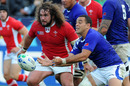 Wales's Adam Jones tracks Samoa's scrum-half Kahn Fotuali'i