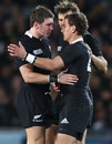 New Zealand's Colin Slade shares a word with team-mate Aaron Cruden