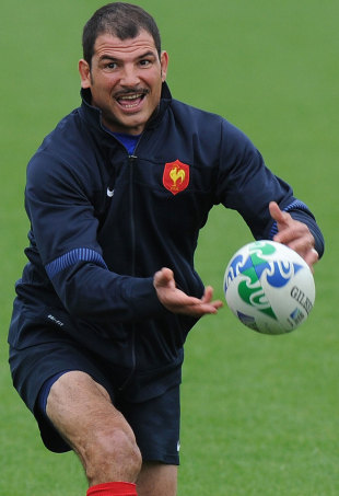 France's head coach Marc Lievremont passes the ball during training, Takapuna Rugby Club in Auckland, New Zealand, October 11, 2011