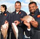 France's Marc Lievremont and Emile Ntamack show off their catch of the day