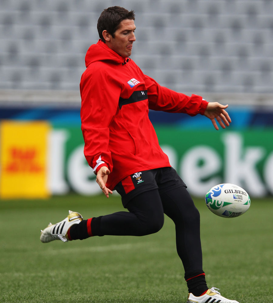 Wales' James Hook launches a kick in training