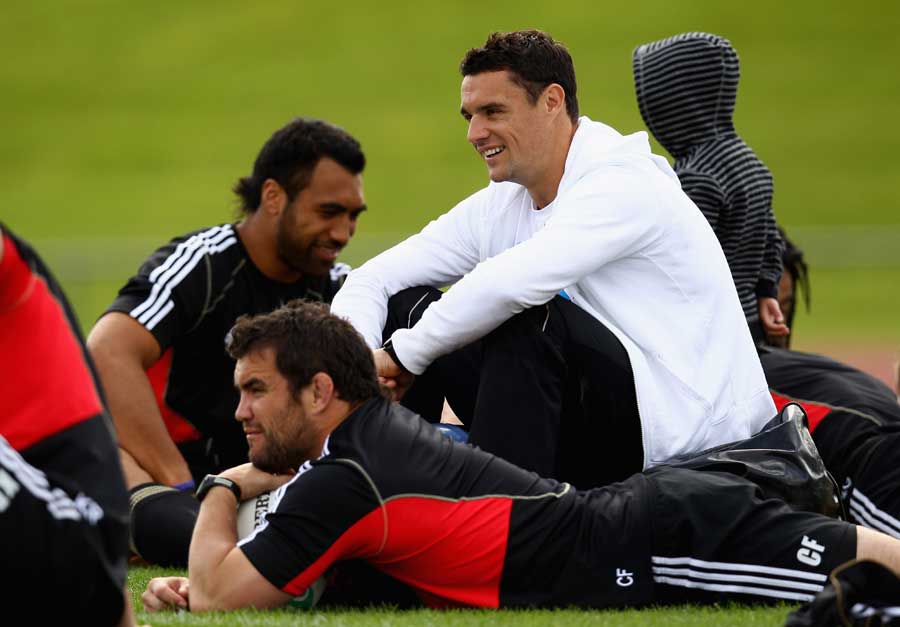 New Zealand's Dan Carter watches on as the All Blacks train