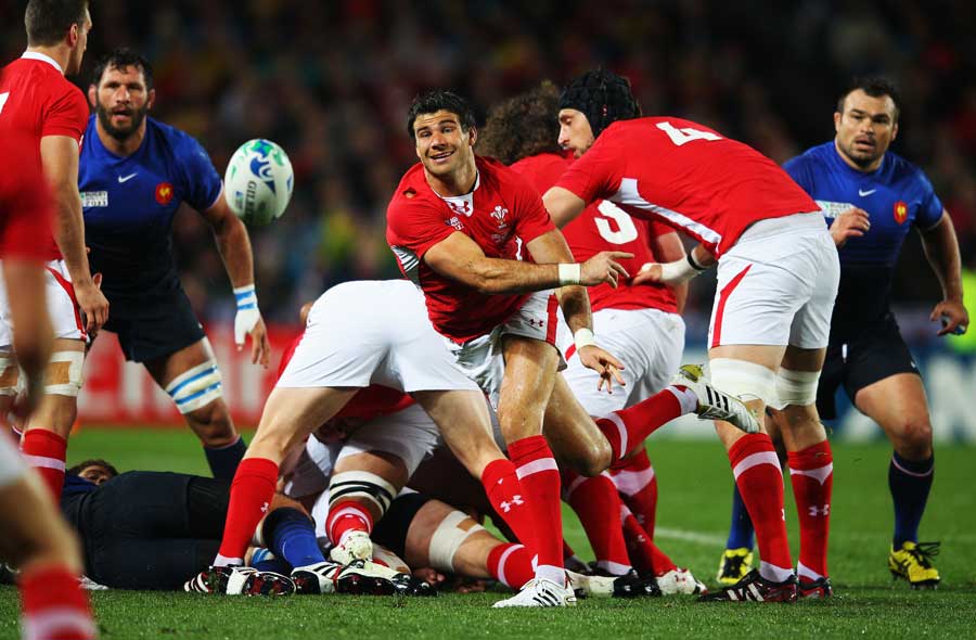 Wales scrum-half Mike Phillips clears the ball