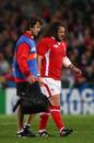 Wales prop Adam Jones limps off with a calf injury