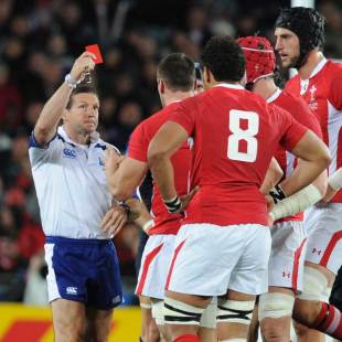 Referee Alain Rolland shows a red card to Sam Warburton