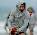 Australia's Quade Cooper throws a football around during a team recovery session