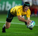 Australia's Berrick Barnes touches down for a try