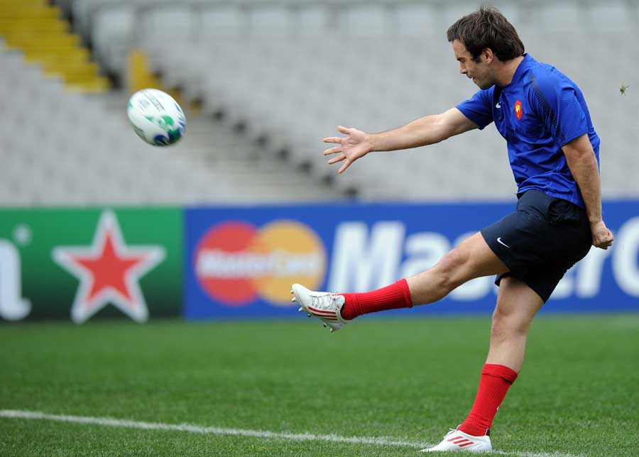 France fly-half Morgan Parra runs through his kicking