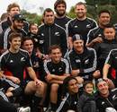 The All Blacks pose for a team photo with friends and families before the World Cup final
