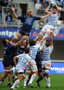 Castres' Scott Murray (R) vies with Montpellier's Thibaut Privat (L) for a lineout
