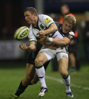 Northampton wing Chris Ashton offloads in the tackle, Ospreys v Northampton Saints, Anglo-Welsh Cup, Brewery Field, Bridgend, Wales, October 22, 2011