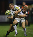 Northampton wing Chris Ashton offloads in the tackle