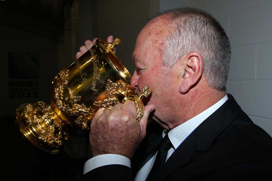 New Zealand coach Graham Henry drinks from the William Webb Ellis cup