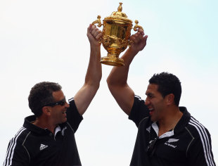 All Blacks assistant coach Wayne Smith and fullback Mils Muliaina hold the Webb Ellis Cup, New Zealand victory parade, Rugby World Cup, Auckland, New Zealand, October 24, 2011