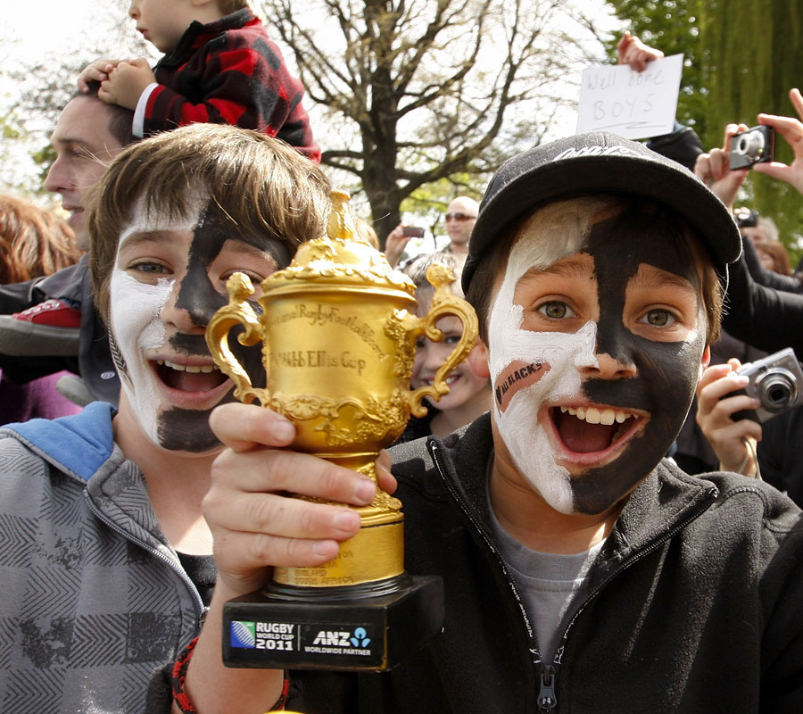 Young All Black fans show off their home-made Webb Ellis trophy