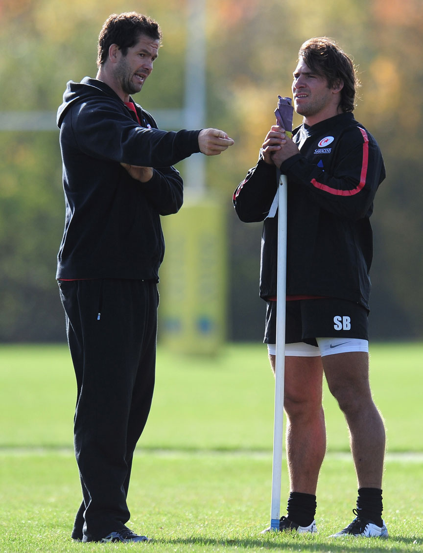 Saracens assistant coach Andy Farrell chats to hooker Schalk Brits
